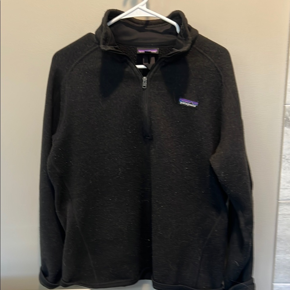 Patagonia woman’s black Patagonia 1/4 zip.